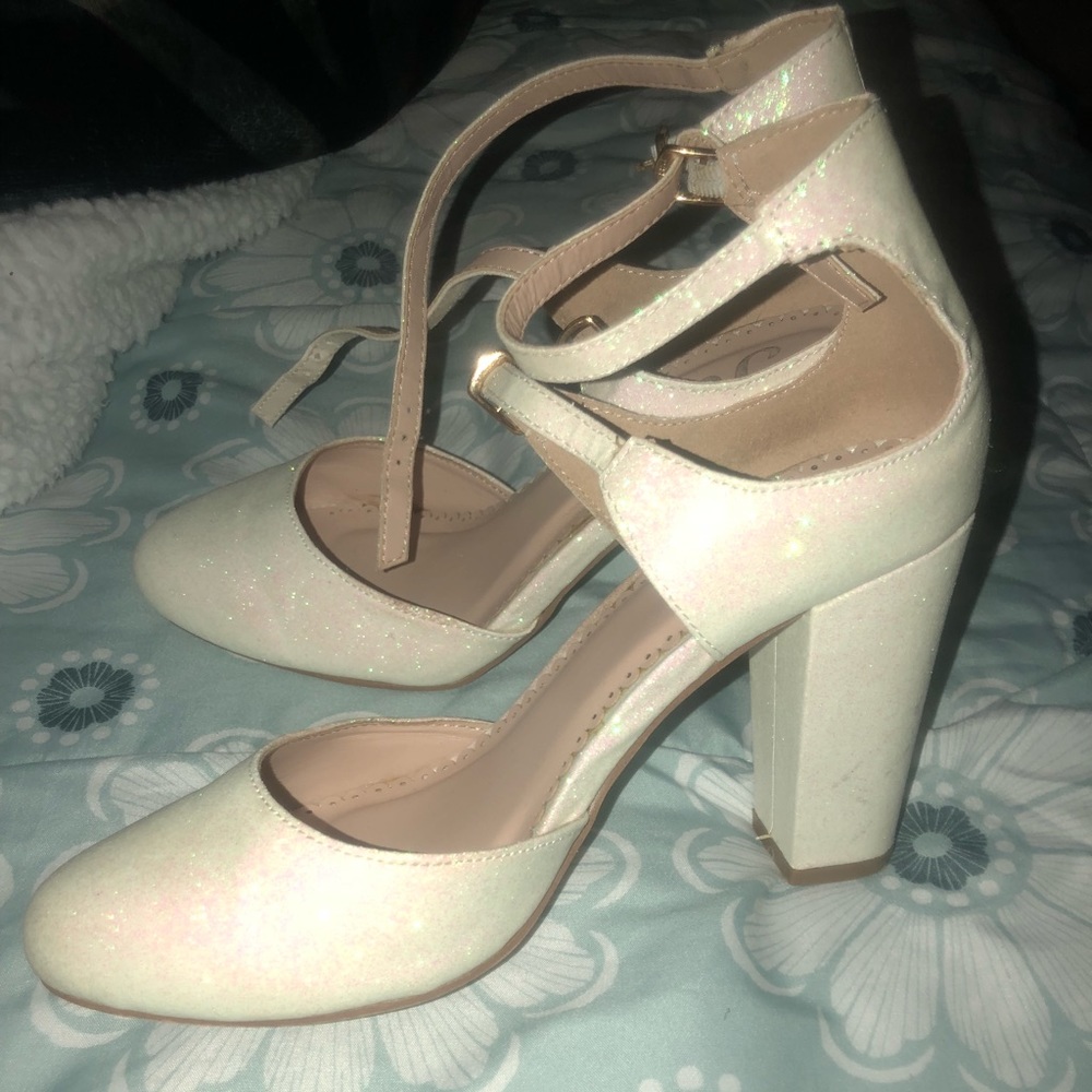 Glittery white heels.